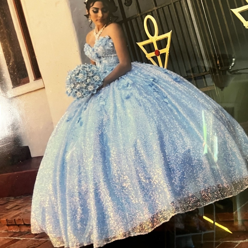 A shinny baby blue quinceañera dress